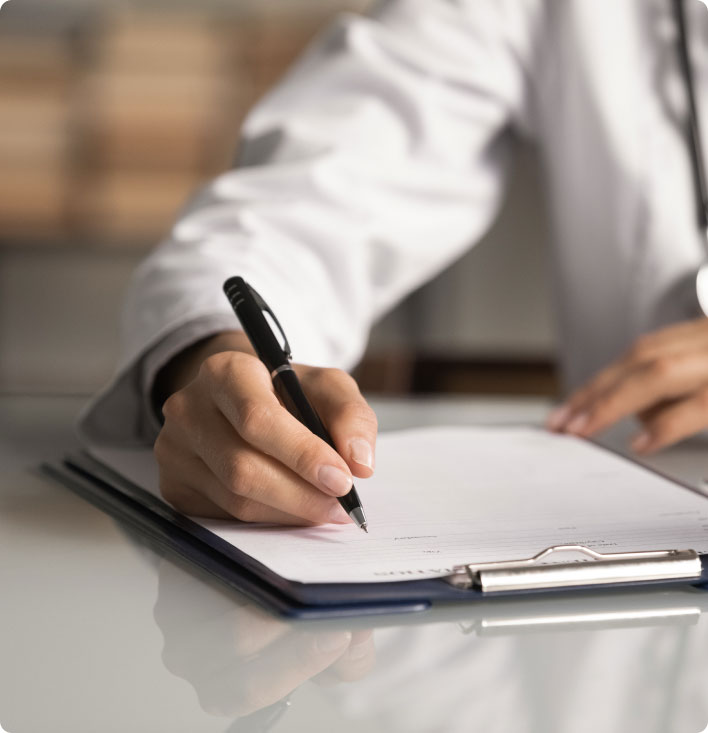 Doctor writing notes about fundoplication