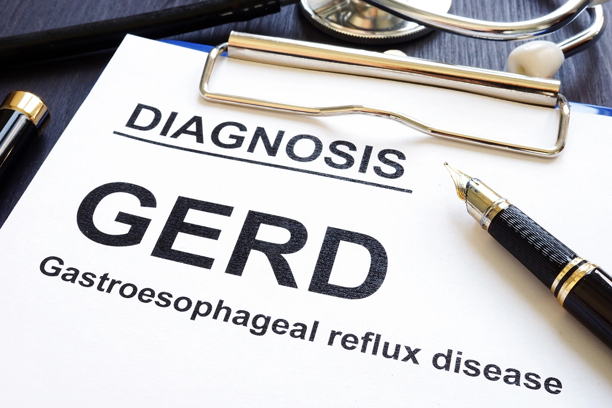 A close-up of a doctor’s memo indicating a GERD diagnosis