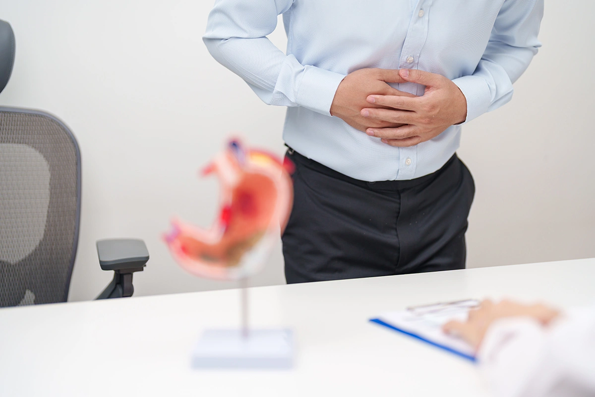 A patient experiencing acid reflux consulting a doctor