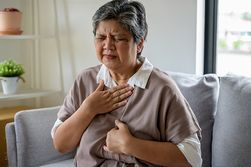 Female patient experiencing persistent GERD symptoms, considering GERD treatment in Singapore.