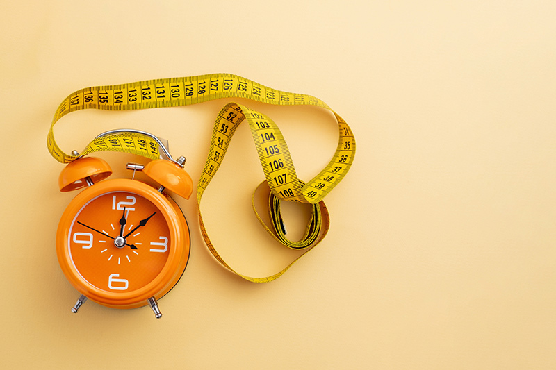 Alarm clock with measuring tapes