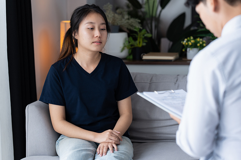 A doctor discussing the results of an acid reflux assessment with his patient