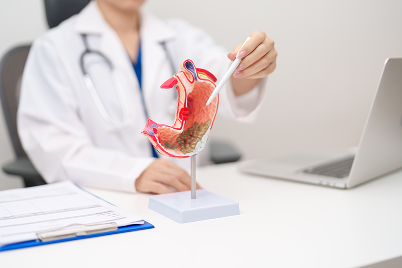A doctor explaining acid reflux to a patient